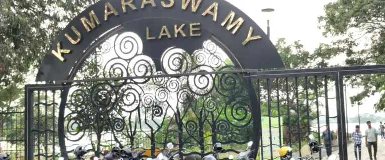 Kumaraswamy Lake Park main entrance arch with golden lettering and artistic tree metalwork, Thadagam Road, Coimbatore